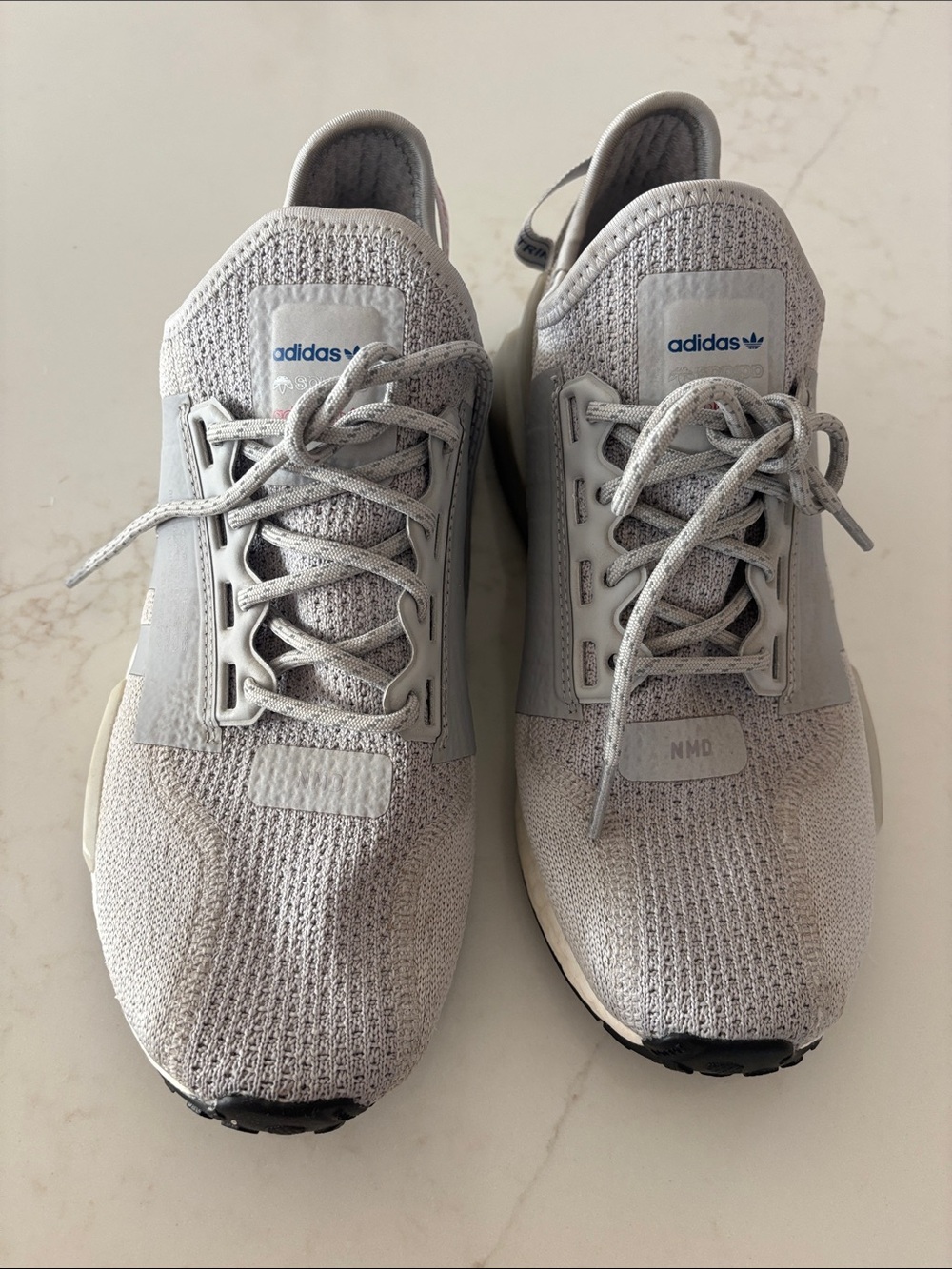 Adidas NMD light grey and white sneakers